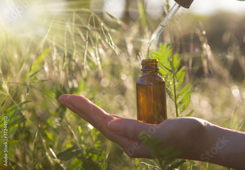 Alternative Medicine - Bottles & Hand. Copy speca. photo