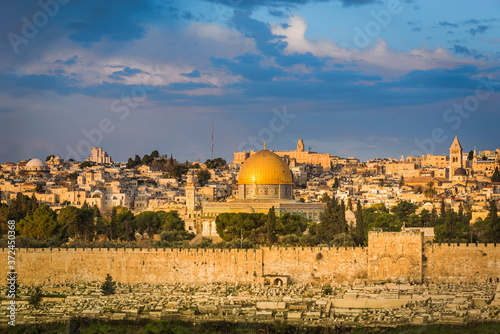 Beautiful morning view of Jerusalem: Golden Gate and the Dome of the Rock on the Temple Mount, with Old City buildings and rooftops, such as Hurva synagogue and Church of the Redeemer clock tower