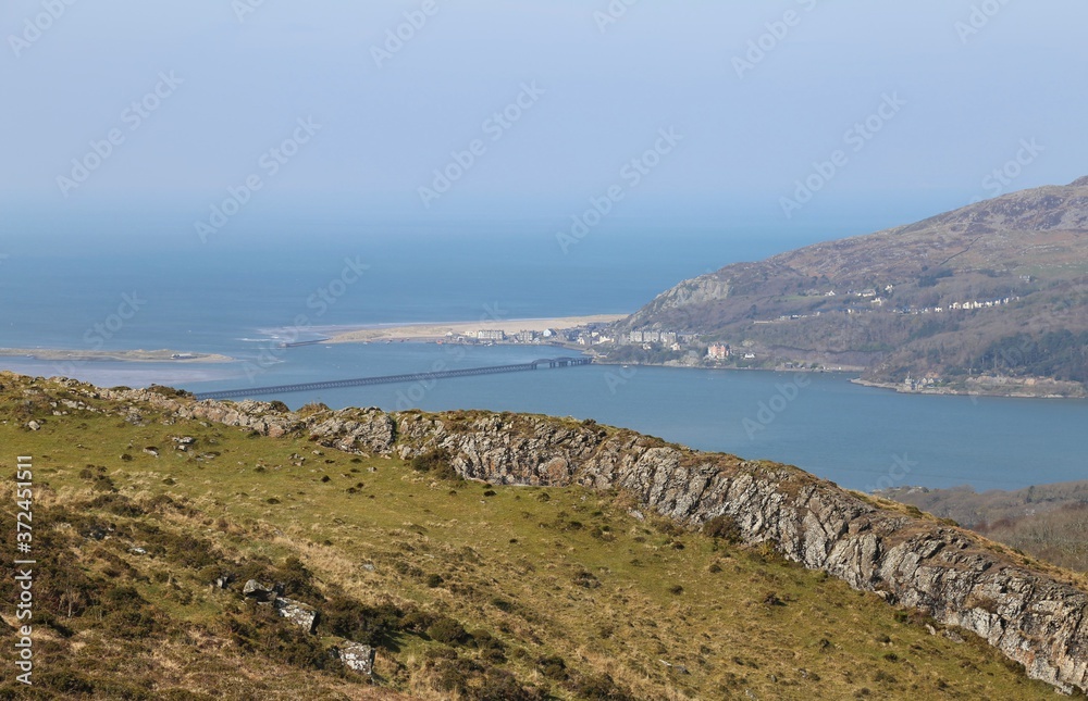 A mountain top view across the Mawddach Estuary towards Barmouth, Gwynedd, Wales.