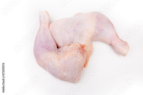 Raw chicken legs on a white background