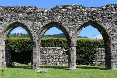  Arched  windows in the ancient Cymer Abbey at Llanelltyd, Gwynedd, Wales, UK. photo