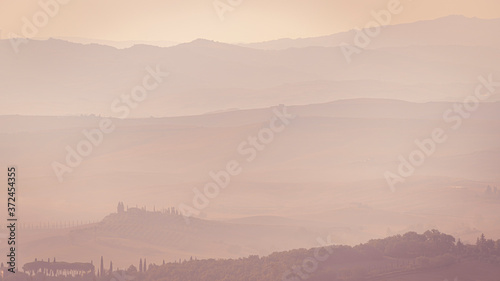 Beautiful sunrise over the Tuscany hills and fields. Travel destination Tuscany