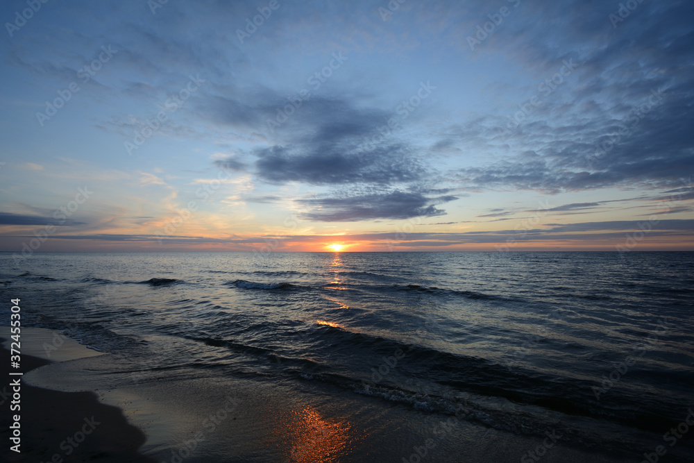 Naklejka premium Picturesque sunset on the Polish coast of the Baltic Sea