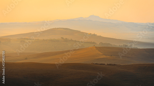 Beautiful sunrise over the Tuscany hills and fields. Travel destination Tuscany