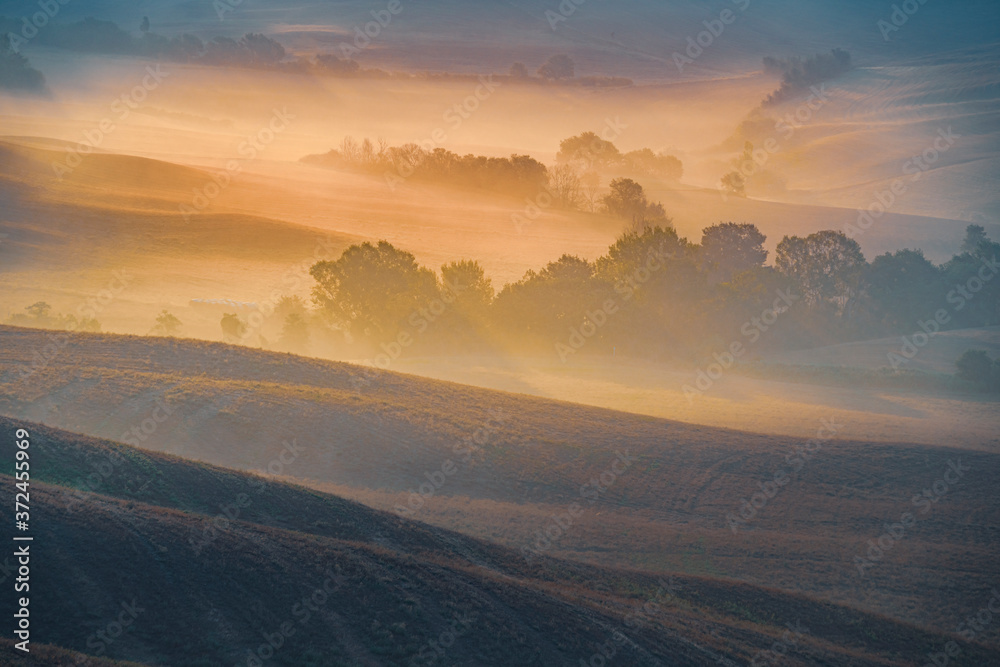 Misty sunrise over the Tuscany hills. Travel destination Tuscany