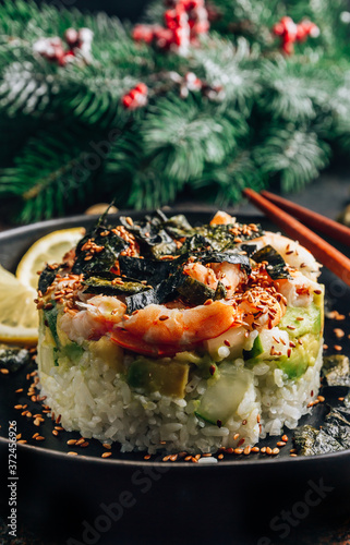 Spicy shrimp sushi stacks with layers of sushi rice, cucumbers and avocado spicy shrimp and furikake