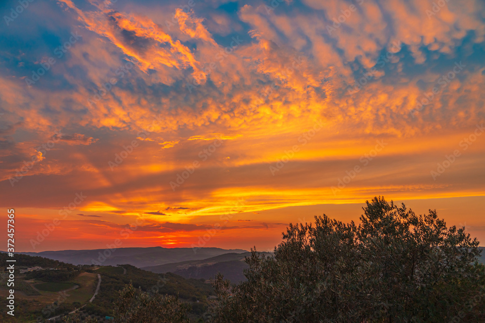 Sunset over the Tuscany hills. Travel destination Tuscany
