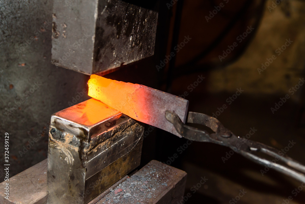 Forging molten metal. Making knives. Forging molten metal. Making knives.