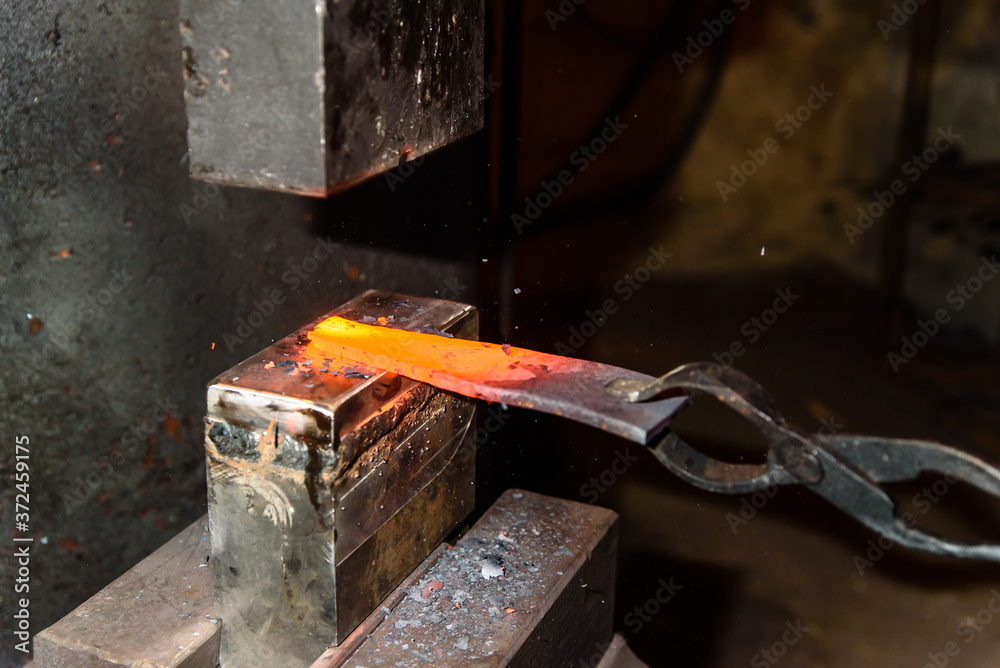 Forging molten metal. Making knives. Forging molten metal. Making knives.