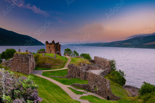 Urquhart Castle at sunset located on the banks of Loch ness, Scotland.