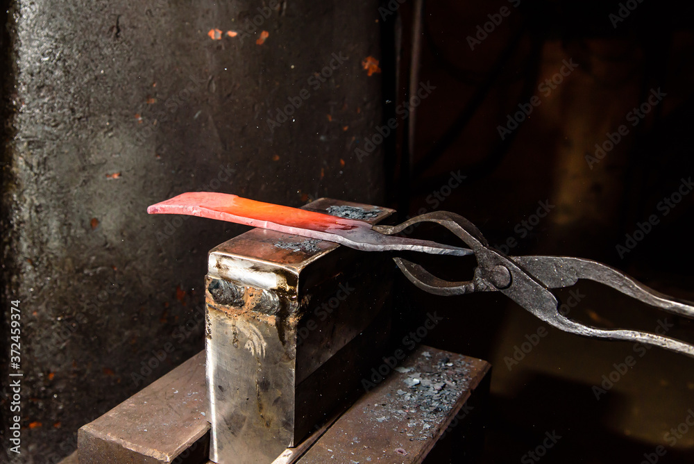 Forging molten metal. Making knives. Forging molten metal. Making knives.