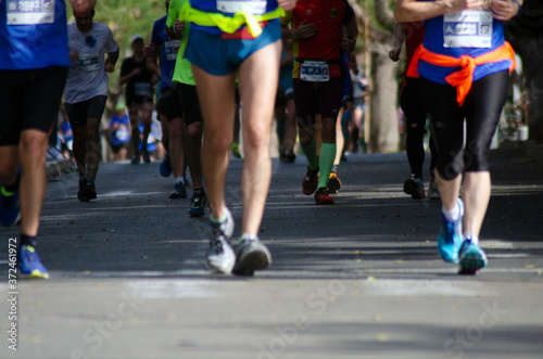 men running in marathon city shoe laces road runner
