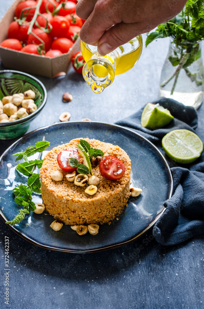 Cous cous with cherry tomato and hazelnut pesto Cous cous with cherry tomato and hazelnut pesto