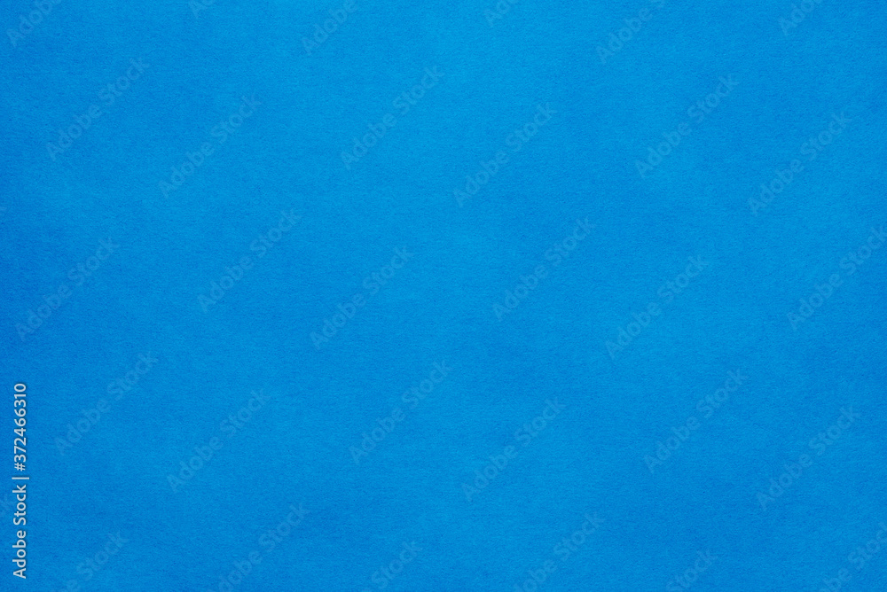 Paper background. The paper texture is blue. An empty page with a copy of the space.