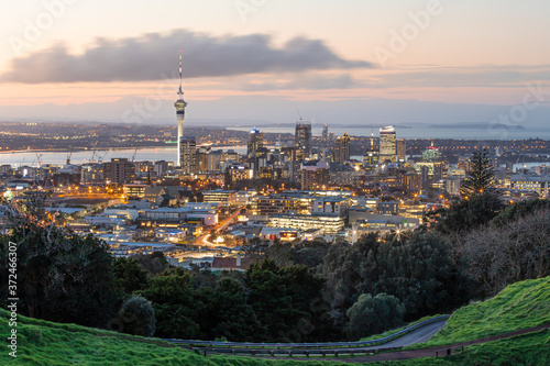 Auckland city skyline with Auckland Sky Tower from Mt. Eden at sunset New Zealand