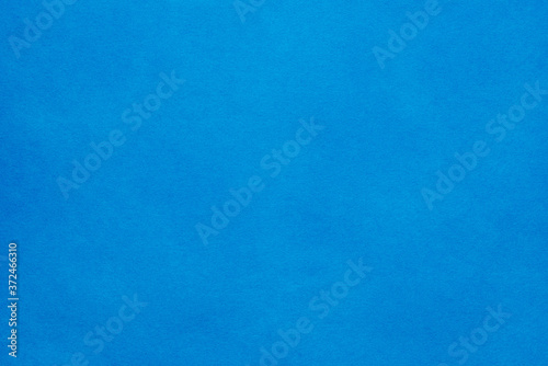 Paper background. The paper texture is blue. An empty page with a copy of the space.