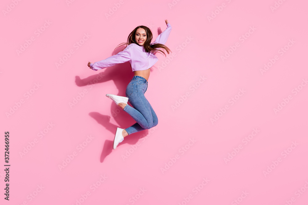 Full length photo of candid pretty girl jump enjoy free time holiday wear good look pullover isolated over pink color background Full length photo of candid pretty girl jump enjoy free time holiday wear good look pullover isolated over pink color background