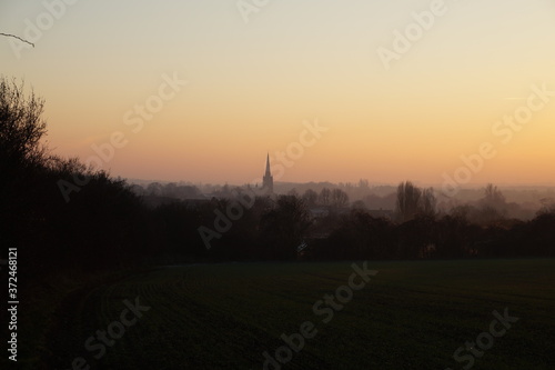 Sunset in the fields, view on Saffron Walden St Mary's church