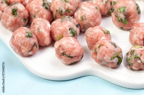 Top view of raw meat balls isolated on white. Meatballs and meatballs