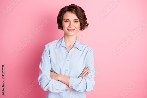 Photo of attractive charming business lady smiling hold arms hands crossed good mood self-confident successful worker person wear blue shirt isolated pink color background