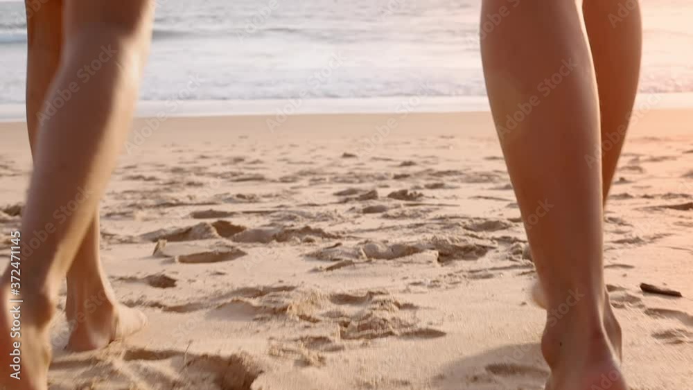 HD Slow motion family running enjoy with tropical sunset beach. Mother and children running together on beach happy with vacation holiday. Holiday travel concept. HD Slow motion family running enjoy with tropical sunset beach. Mother and children running together on beach happy with vacation holiday. Holiday travel concept.