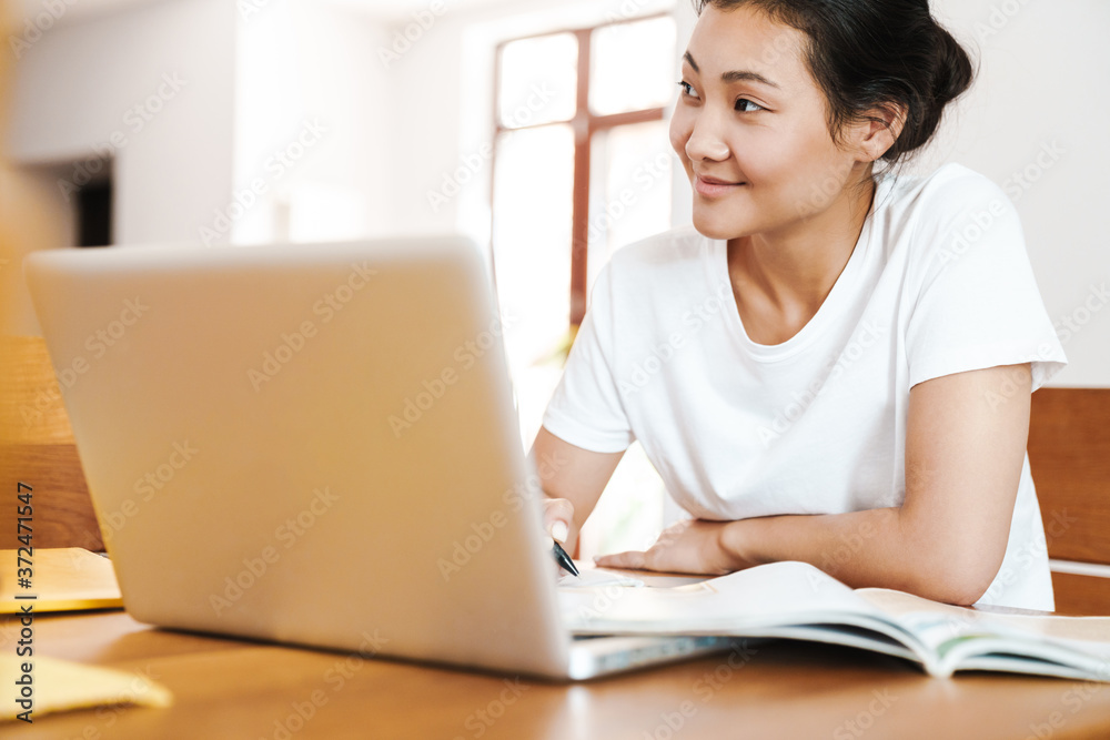 Happy asian female student learning online Happy asian female student learning online