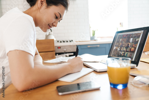 Happy asian female student learning online © Drobot Dean