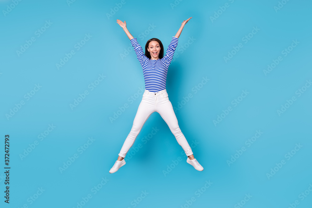 Full length body size view of her she nice attractive lovely overjoyed cheerful cheery funky girl jumping having fun fooling isolated bright vivid shine vibrant blue color background