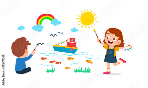 happy cute little kid boy and girl draw with paint on wall together