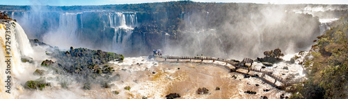 Viewpoint near Devil's throat falls of Iguacu waterfalls, Brazilian side, on a sunny day  photo