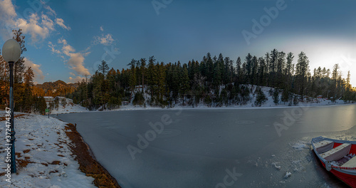Frozen lake in mountains, Banjosa Lake is an artificial lake and a tourist resort 18 kilometers from the city of Rawalakot in Poonch District of Azad Kashmir, Pakistan. photo