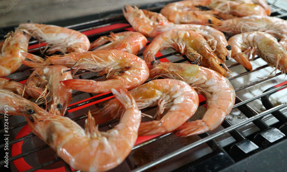 Grilled shrimps on the stove, seafood.