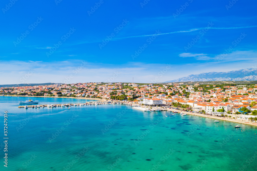 Croatia, beautiful Adriatic coastline, town of Novalja on the island of Pag, city center and marina aerial view from drone