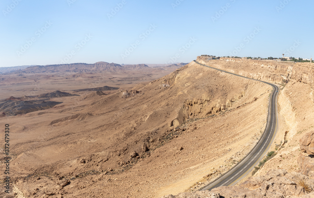 The cliff  on which the Mitzpe Ramon city is located and the road descending from it and leading to Eilat in the Judean Desert in Israel