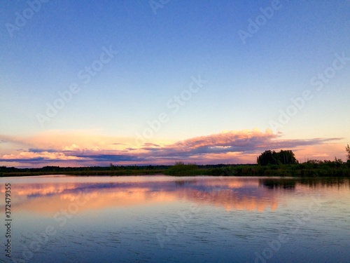 sunset over the lake © Olga Svyatenko