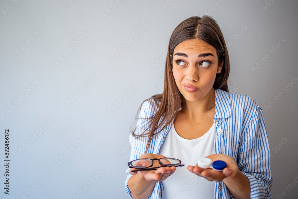 Girl Comparing Contacts to Eyeglasses for Vision Correction. Woman