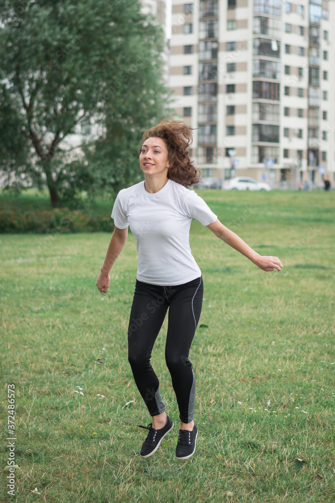 Young Muscular Fitness Woman Doing Squats Exercise Young Muscular Fitness Woman Doing Squats Exercise