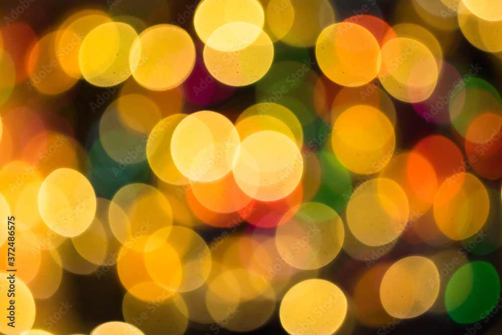 Defocused multicolored christmas lights background, bokeh. New year, holidays. Defocused multicolored christmas lights background, bokeh. New year, holidays.