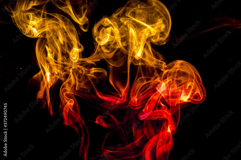 Obraz premium Colored smoke on black background