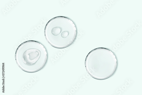 Petri dishes with cosmetic smudge and drops isolated realistic vector illustration. Concept laboratory tests and research. Transparent chemistry glassware on light blue background