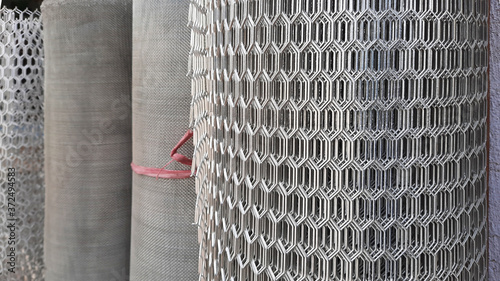 pile of metal mesh or fence rolls with selective focus