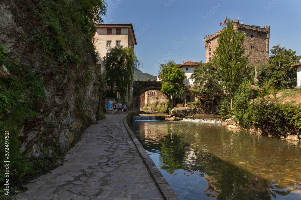 Views of the medieval town of Potes with hanging houses and the Deva river, Cantabria, Spain