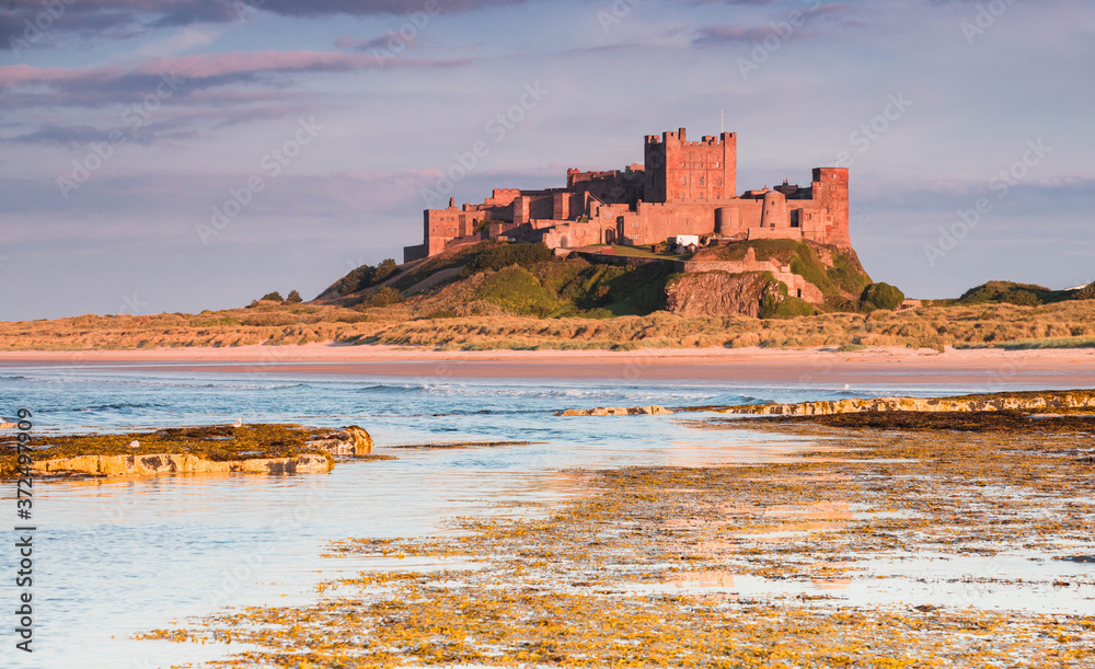 Bamburgh Castle, Northumbria at sunset on a warm summer evening