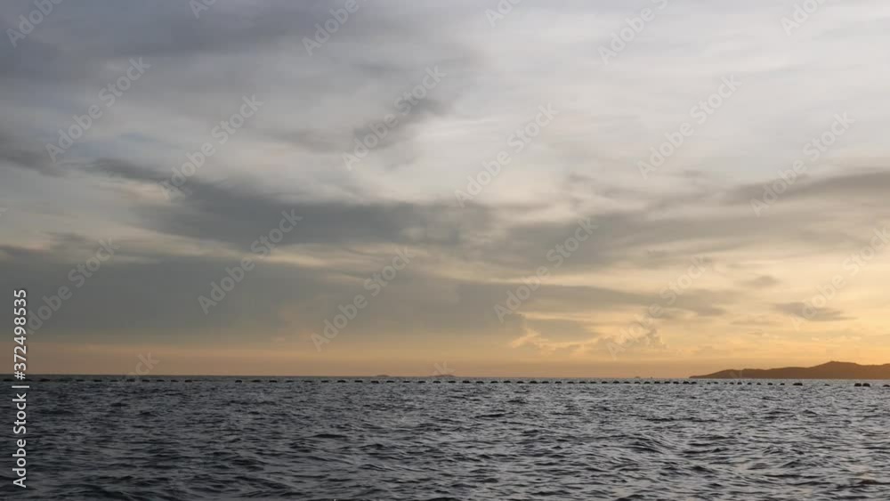 Panorama view Waves sea sunset background beautiful moving.
Panorama view Waves sea sunset background beautiful moving.