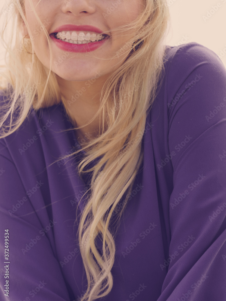 Fototapeta premium Woman with red lips having braces