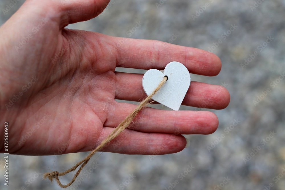 custom made wallpaper toronto digital
Pendant in the shape of a heart on the hand.