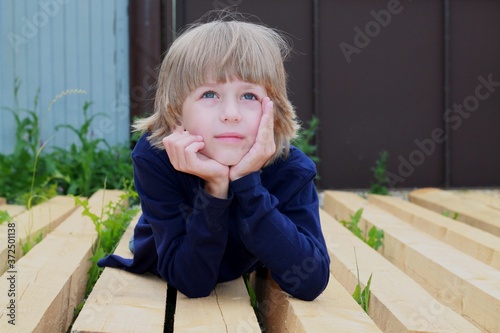 Wallpaper Mural little boy sitting on a bench Torontodigital.ca