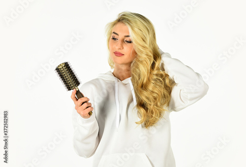 Hairdressing is our passion. curls hairstyle. Girl with long blonde blowing curly hair. womens beautiful curly hair. Hairstyle with curly hair. Curly Hair. Curling hairbrush. Stylist curling for girl