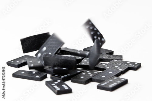 The domino board game. Black chips. White background