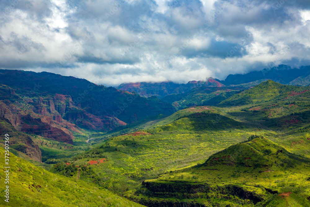 Waimea Canyon, also known as the Grand Canyon of the Pacific, is a large canyon, approximately ten miles long and up to 3,000 feet deep, located on the western side of Kauaʻi, Hawaii